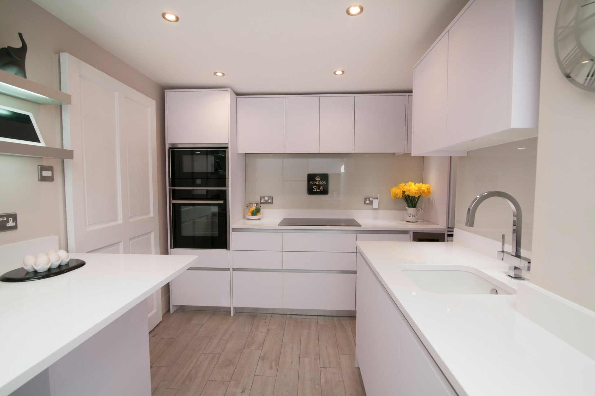 Contemporary white handless lacquered kitchen design